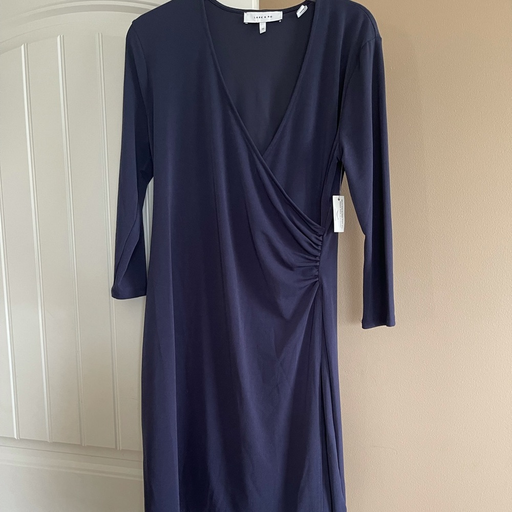 Navy faux wrap dress with ruching at the waist.